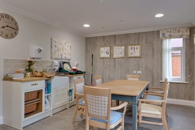 Bright activity room with a large table and chairs