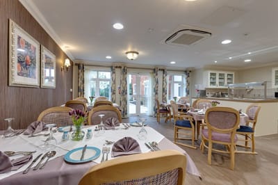 Bright dining room setup with tables and chairs
