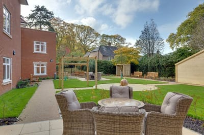 Resident enjoying the outdoor garden area