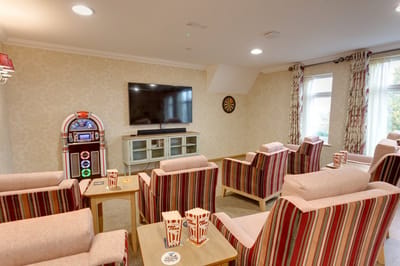 Common area with seating and popcorn in a recreational space