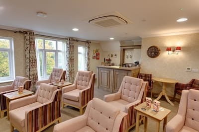 Cozy common area with comfortable seating and a bar.