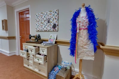 Interior display with sewing machine and costume