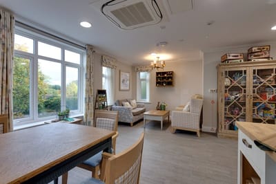 Bright interior common area with seating and windows