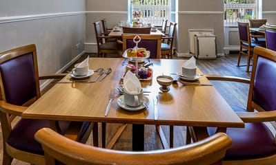 Dining area set with food and table settings