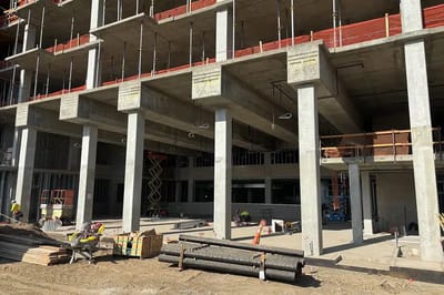 Construction site of a facility with workers present