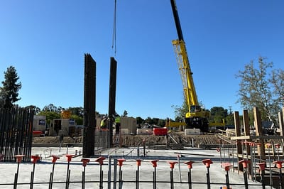 Construction site with cranes and workers