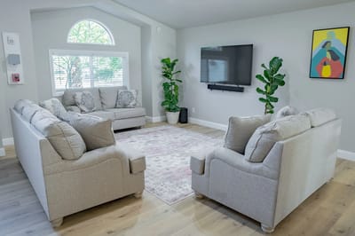Bright common area with comfortable seating and artwork