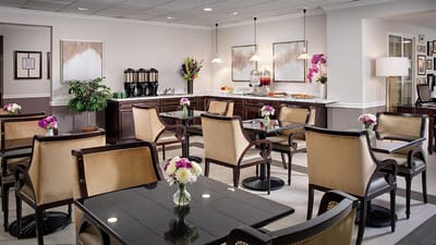Bright dining area with tables and flower arrangements