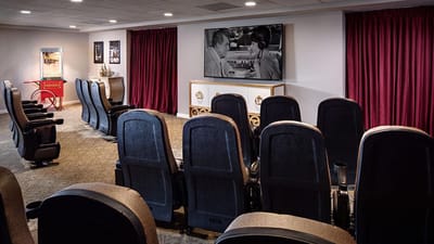Cozy movie theater with plush seating and a large screen