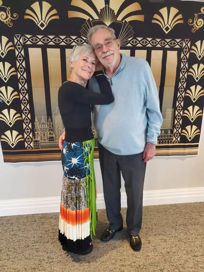 Two residents sharing a moment in a cheerful setting