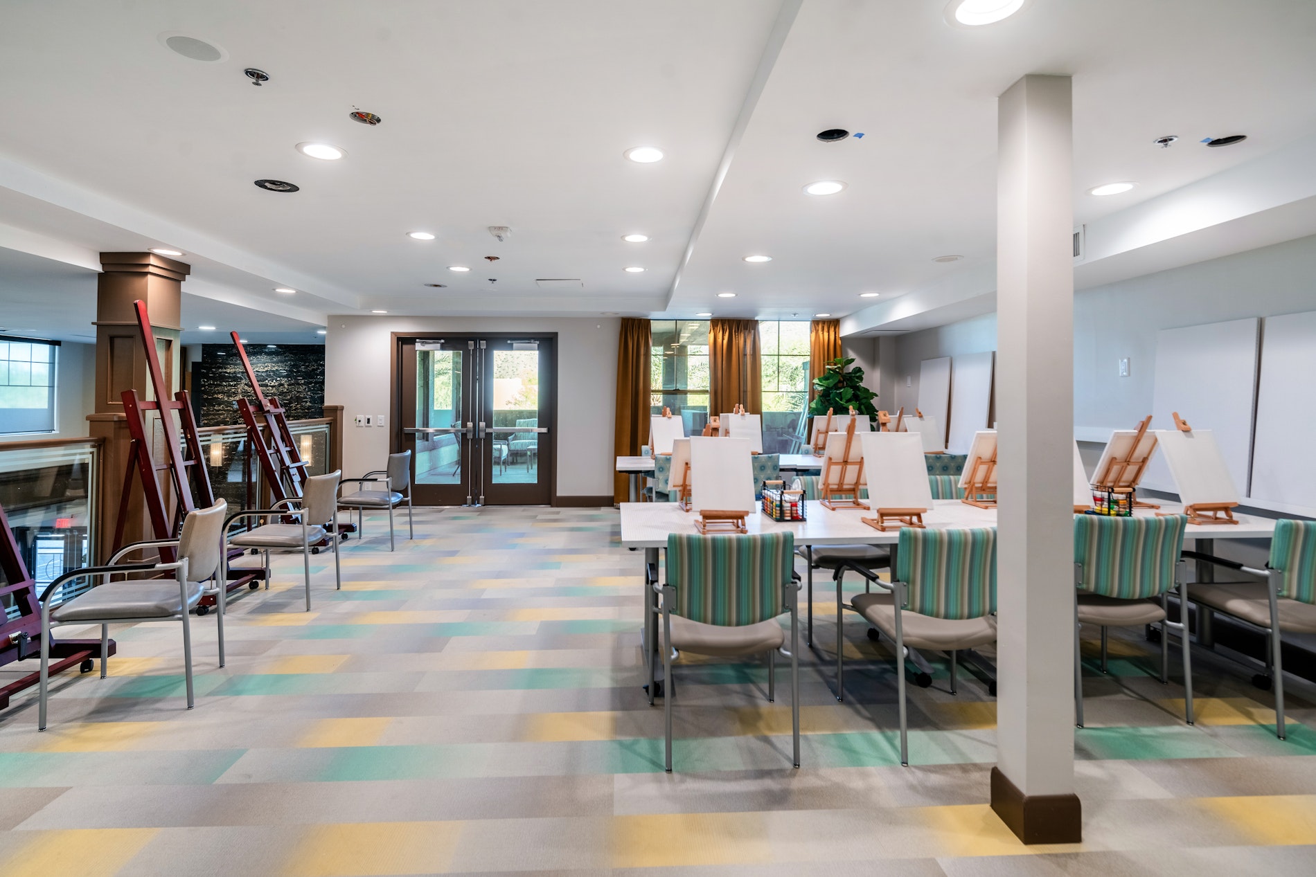 Bright interior of an activity room with easels