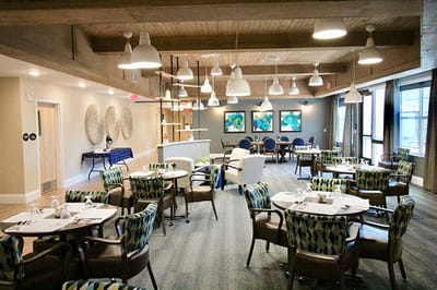 Bright dining area with colorful chairs and tables