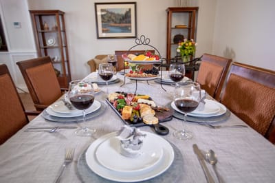 Elegant dining setup with wine and a charcuterie board