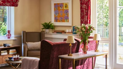 Cozy interior lounge with seating and flowers