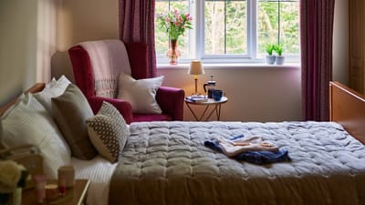 Cozy resident room with homey decor and natural light