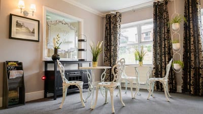 Bright common area with decorative seating and plants
