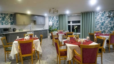 Dining room setup with tables and chairs