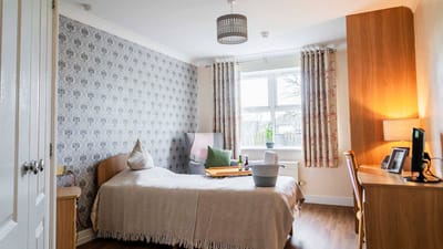 Cozy resident room with natural light and personal touches