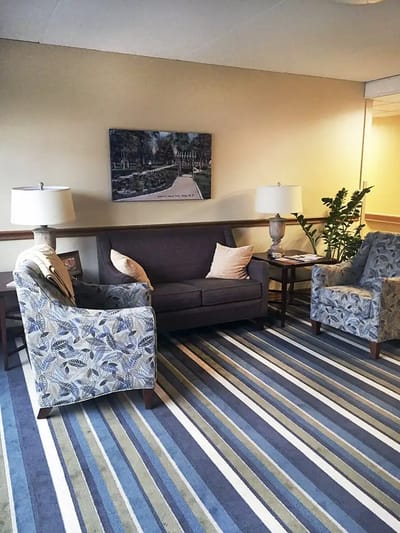 Cozy common area with couches and lamps
