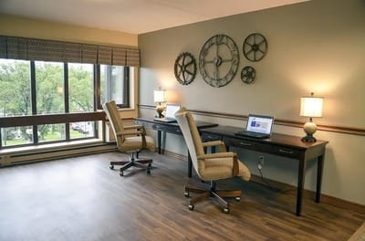 Bright interior space with chairs, desks, and décor