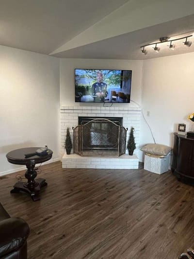 Interior view of a living area with a TV and fireplace