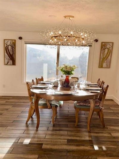 Dining area with a table set and natural light