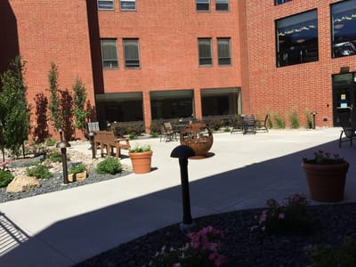 Outdoor courtyard with seating and garden elements