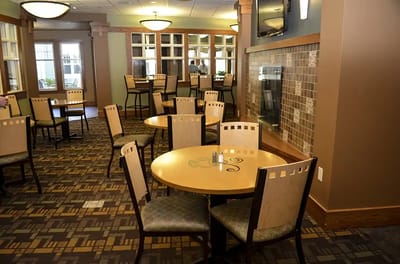 Cozy dining area with tables and chairs