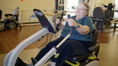 Resident exercising in a therapy room