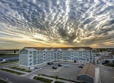 Aerial view of a retirement living facility at sunset