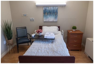 Cozy private resident room with bed and decor