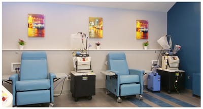 Interior view of a treatment room with recliner chairs