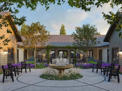 Beautifully landscaped courtyard with a fountain and seating