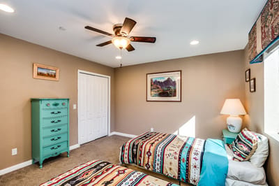 Brightly decorated resident room with twin beds