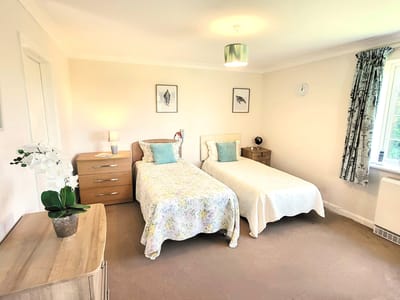 A well-furnished shared bedroom in the care home
