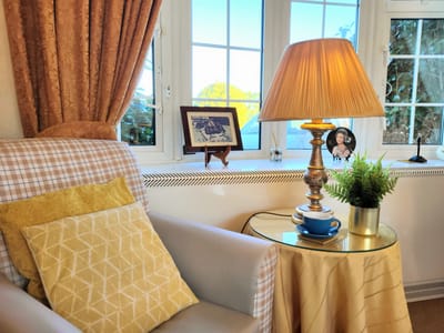 Cozy interior of a lounge area with a lamp and decor