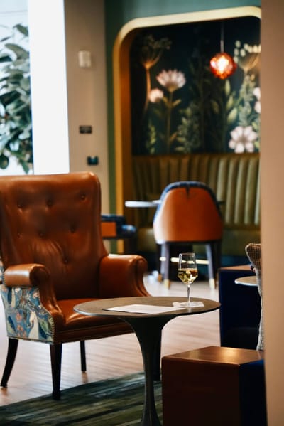 Cozy common area with a glass of wine