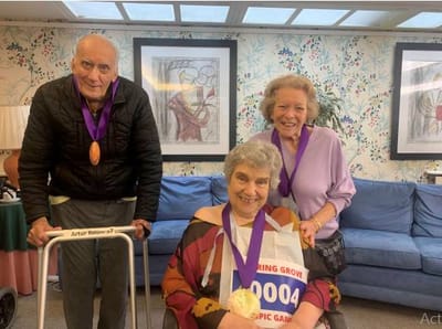Residents celebrating at an activity event in the facility.