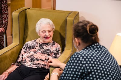 Engaging interaction between a staff member and a resident.