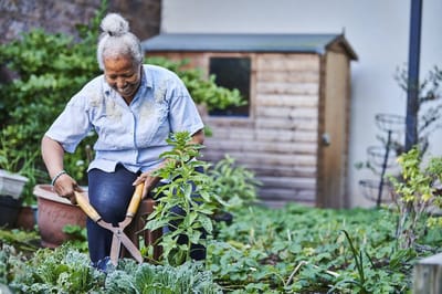 Senior woman gardening at Lovat Fields Retirement Village.