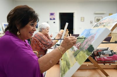 Residents engaged in a painting activity
