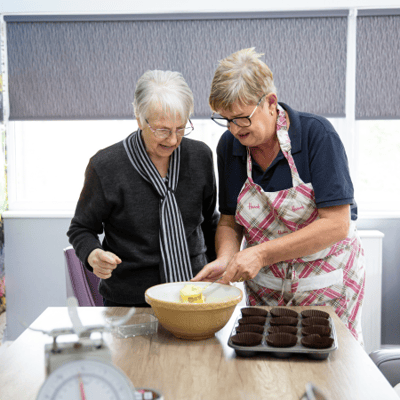 Residents engaged in baking activity.