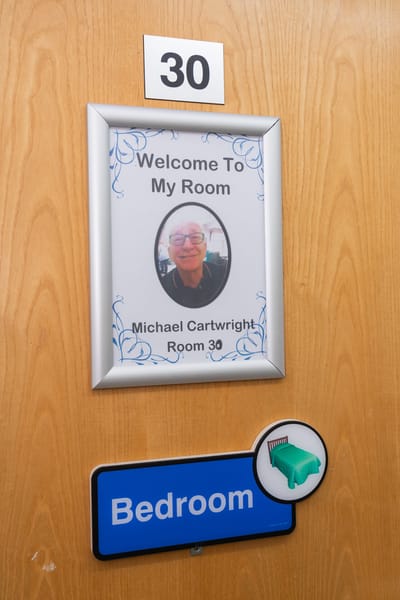 Personalized room sign with resident photo