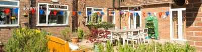 Outdoor seating area with festive bunting