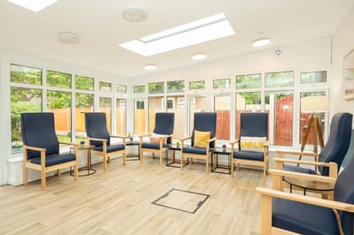 Bright common area with comfortable chairs and decorations.