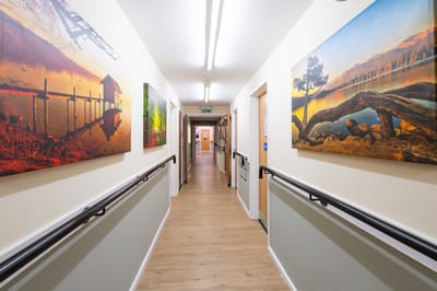 Bright hallway with paintings on the walls