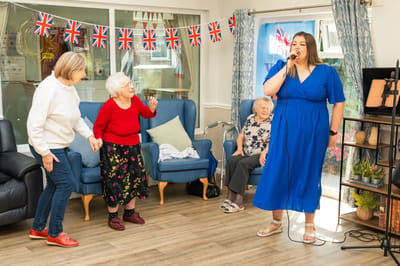 Residents enjoying a singing activity together
