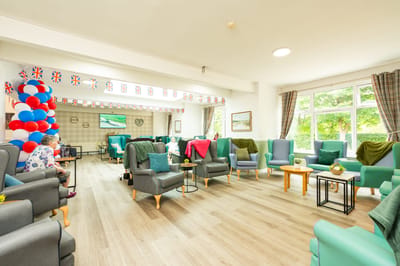 Comfortable lounge area with residents and decorations