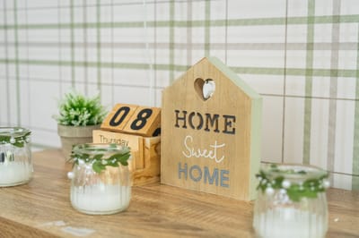 Decorative 'Home Sweet Home' sign on a table.