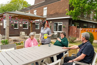 Residents enjoying outdoor time with staff